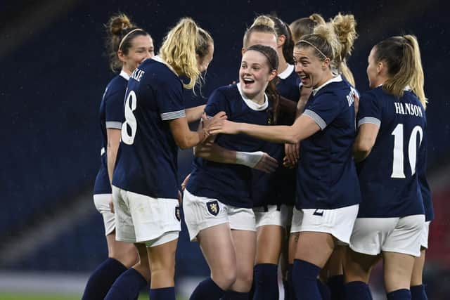 Emma Watson is embraced by her teammates after scoring the opening goal on Tuesday. (Photo by Rob Casey / SNS Group)