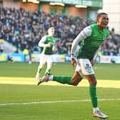 Demetri Mitchell wheels away after scoring on his first start for Hibs
