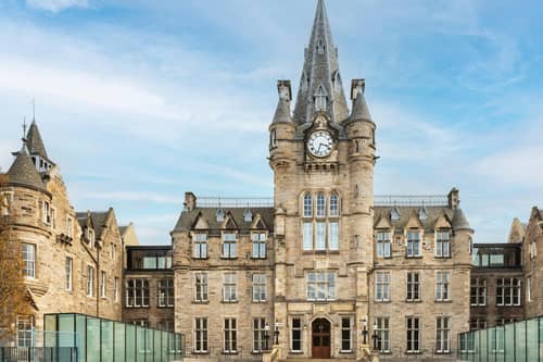 The grand front entrance of the new Edinburgh Futures Institute, the result of a major 'recycling' project which has transformed the historical Royal Infirmary of Edinburgh building into a state-of-the-art innovation hub and public space