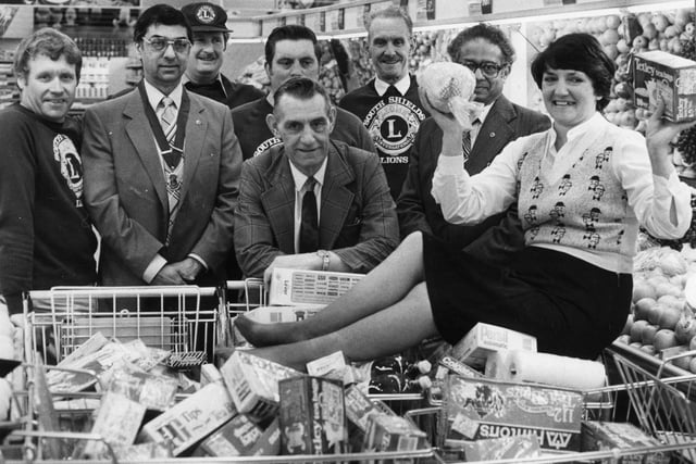 Margaret Raine did the three minute trolley dash round Hinton's store for her father George Elsy, centre, when his ticket came up in a draw held by the Lions Club. Remember it?