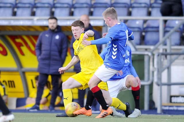 Leo Watson, seen here in yellow during a fundraising match playing for Hearts, has returned to his parent club. Stock picture by Michael Gillen