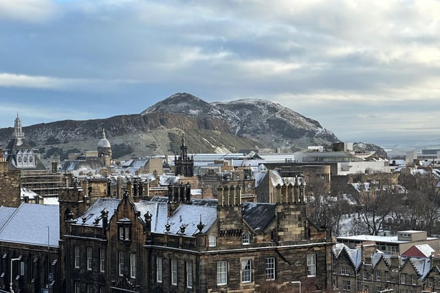 A light sprinkle of snow fell upon the ancient volcano, which towers over Edinburgh's city centre.