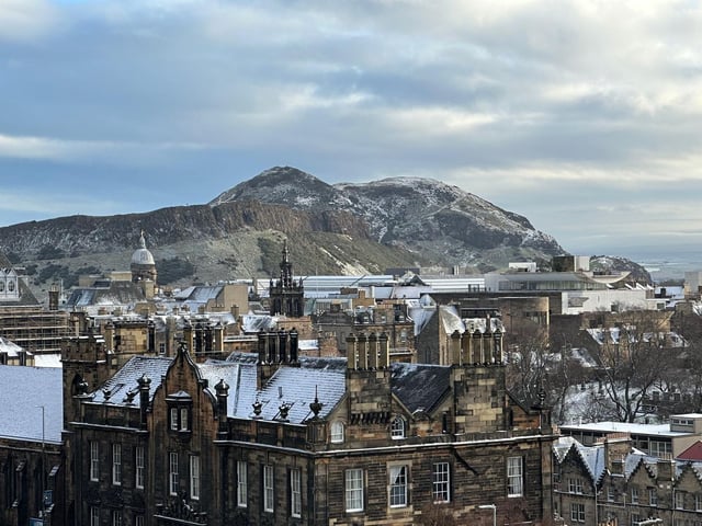 A light sprinkle of snow fell upon the ancient volcano, which towers over Edinburgh's city centre.