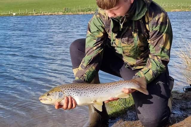 Calvin Kay with a cracking brown trout from Tweeddale Millennium near Gifford. Picture: John Jackson