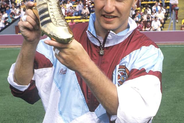 Hearts striker John Robertson shows off his golden boot trophy for season 1989/1990 with 22 goals
