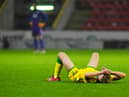 A gutted Josh Doig pictured at the end of the match at Pittodrie