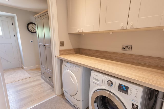 The utility room can accommodate a washer and dryer.
