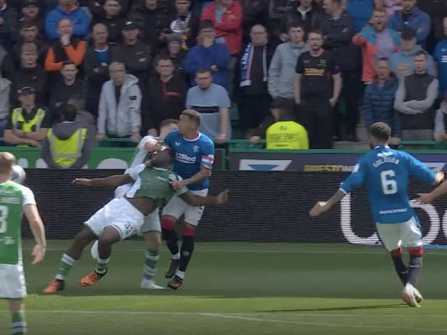 A freezeframe from Sky Sports' coverage of Rangers captain James Tavernier's challenge on Rocky Bushiri that led to shouts for a Hibs penalty