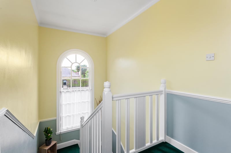 The light stairwell with feature window up to upstairs. Further benefits at this property include gas central heating, sash and case windows, attic space and hatch, and on-street parking.