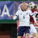 Hearts' Liam Boyce (left) attempts to win a header while playing for Northern Ireland against Austria.