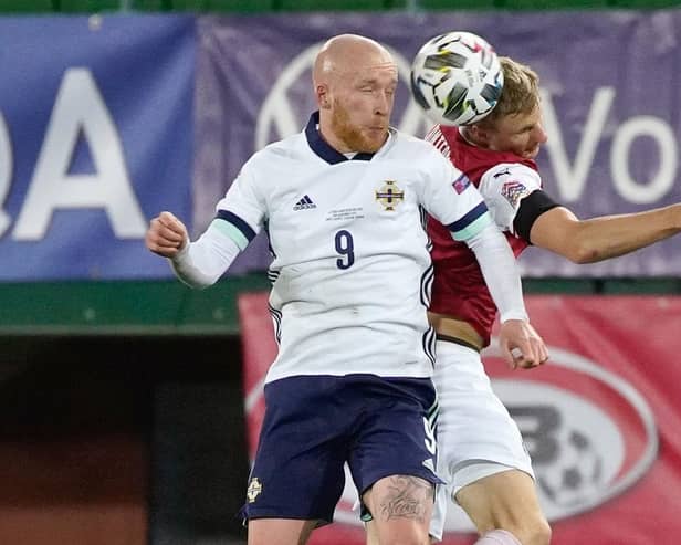 Hearts' Liam Boyce (left) attempts to win a header while playing for Northern Ireland against Austria.
