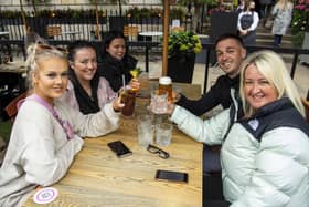A group of friends enjoying their newfound freedom at Edinburgh's Tigerlily in George Street as drinking alcohol outdoors is permitted from today.