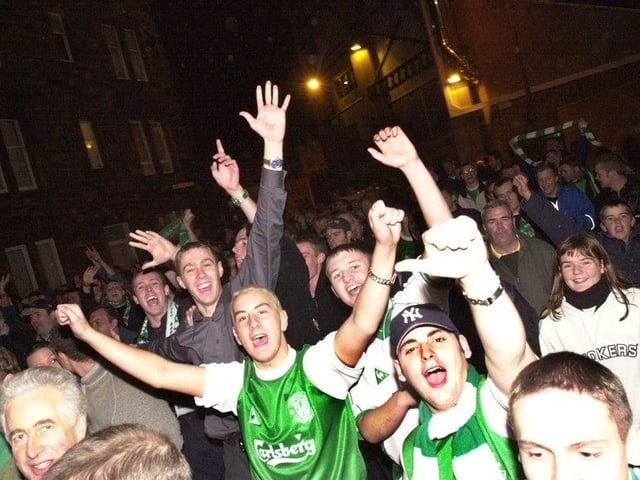 Joyous Hibs fans can be seen making their way down Albion Road following the landmark 6-2 victory against their rivals, Hearts, on 22 October 2000.
