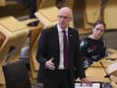 Deputy First Minister John Swinney updates MSPs on any changes to the Covid-19 restrictions in the debating chamber of the Scottish Parliament in Edinburgh. Picture date: Tuesday November 9, 2021.