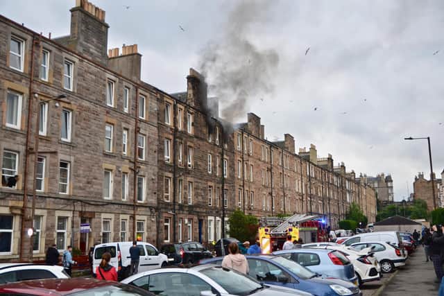 Smoke could be seen billowing from the top floor flat (Pic: Duncan Blair)