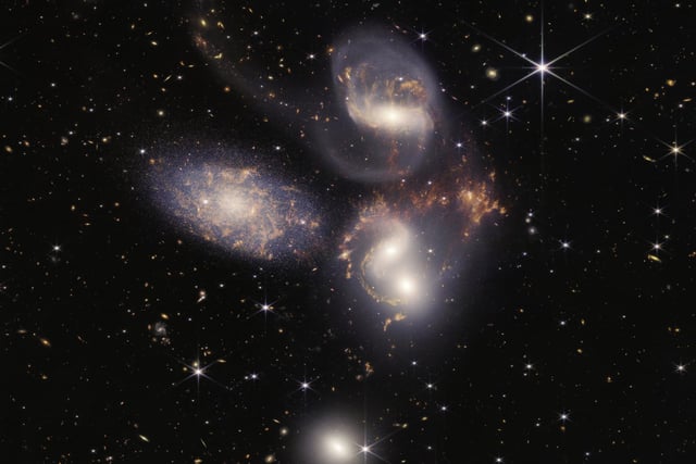 Another look at Stephan's Quintet captured by the James Webb Space Telescope. This image shows in rare detail how interacting galaxies trigger star formation in each other and how gas in galaxies is being disturbed. It also shows outflows driven by a black hole in Stephan’s Quintet in a level of detail never seen before.