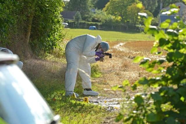 A forensics officer at the scene in Balerno in 2015.