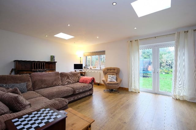The large Family Room with French doors to the rear garden.