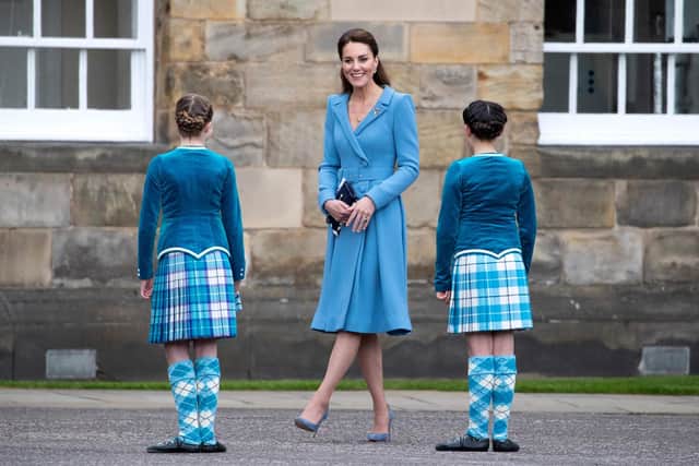 Catherine, Duchess of Cambridge meets Highland dancers during a Beating Retreat by The Massed Pipes and Drums of the Combined Cadet Force in Scotland at the Palace of Holyroodhouse in Edinburgh, Scotland on May 27, 2021, the final day of their week-long visit to the country.