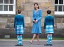 Catherine, Duchess of Cambridge meets Highland dancers during a Beating Retreat by The Massed Pipes and Drums of the Combined Cadet Force in Scotland at the Palace of Holyroodhouse in Edinburgh, Scotland on May 27, 2021, the final day of their week-long visit to the country.