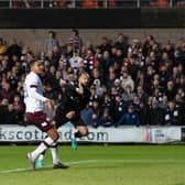 Craig Gordon stretches to save Steven Fletcher's effort during Hearts' 2-2 draw with Dundee United as Toby Sibbick watches on. Picture: SNS