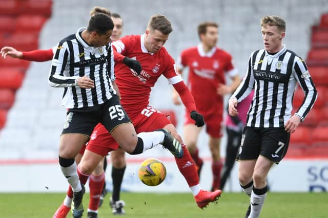 Aberdeen's Florian Kamberi (centre) is challenged by Ethan Erhahon (L) and Jak Doyle-Hayes of St Mirren during Saturday's 0-0 draw with St Mirren  (Photo by Ross MacDonald / SNS Group)