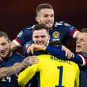 Scotland's players react to Kenny McLean's winning penalty after the Euro 2020 Play off match between Scotland and Israel at Hampden Park. (Photo by Craig Williamson / SNS Group)
