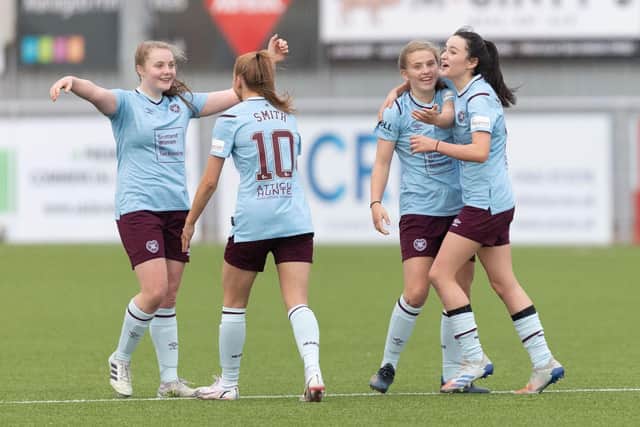 Amelie Birse celebrates with her team-mates during the 3-2 win at Aberdeen, where she netted twice. Picture: Stephen Dobson