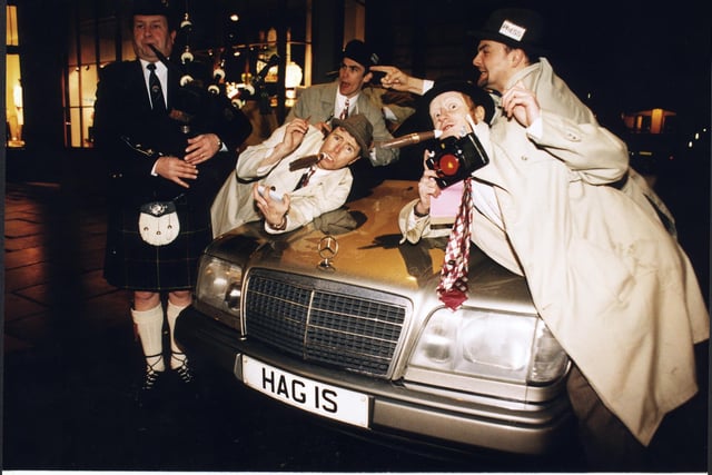 A bunch of 'reporters' posed with a Burns-themed car, which had the registration number 'HAG IS', for the Evening News Burns Supper at the Assembly Rooms in 1997.