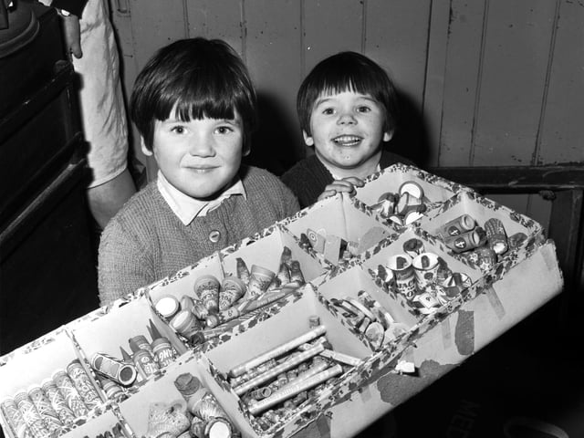 Edinburgh sisters Joan and Donna Pattie look forward to Bonfire Night 1967 with a box of Standard fireworks.