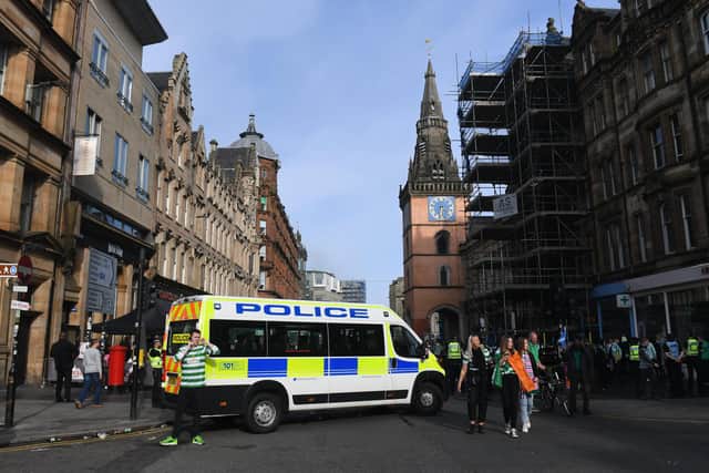 Police closed off several streets around Glasgow Cross during the mass gathering of Celtic fans on Saturday. Picture: Craig Foy/SNS Group