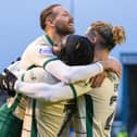 Martin Boyle, Elie Youan and Emiliano Marcondes celebrate a Hibs win.