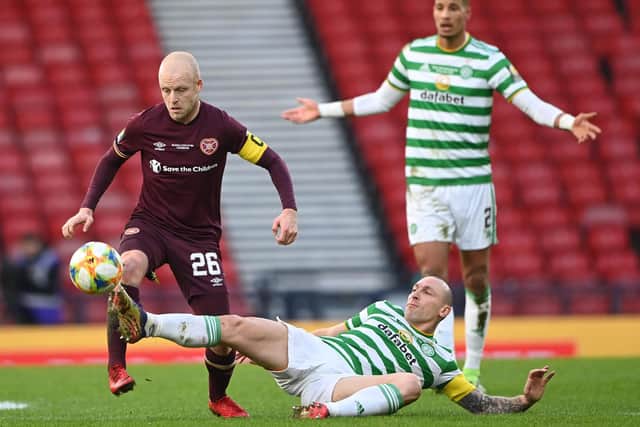 Hearts captain Steven Naismith with his Celtic counterpart Scott Brown.