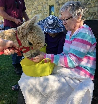 Residents, including Sheena Thomson, enjoyed an afternoon in their company, feeding and stroking them