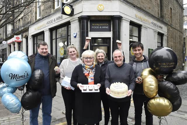 Margiotta on Forrest Road celebrates stocking Mimi’s Bakehouse goods including an exclusive birthday loaf. Pictured: Back - Mike Phillips, Ashley Harley, Gemma Clearie. Front - Michelle Phillips and Franco Margiotta, Joe Margiotta.
Pic Greg Macvean.
