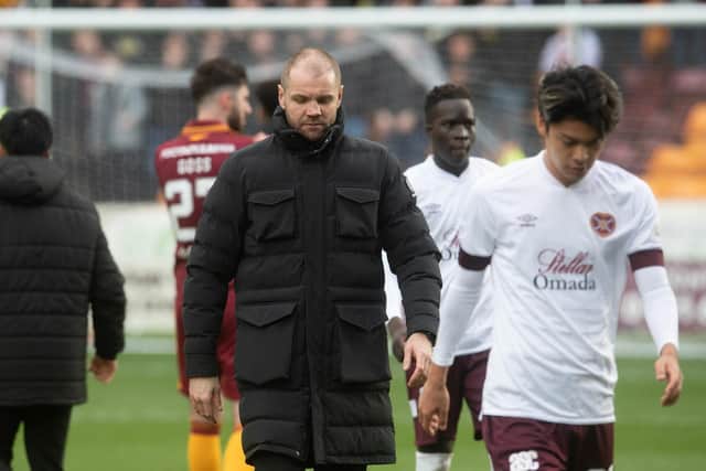 Hearts manager Robbie Neilson looks dejected at full-time at Fir Park.
