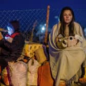 Helena and her younger brother Bodia from Lviv, Ukraine, are seen at the Medyka border crossing in eastern Poland (Picture: Wojtek Radwanski/AFP via Getty Images)