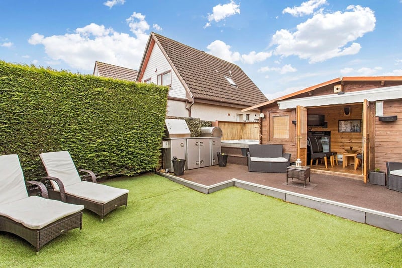 This property also features a southwest-facing rear garden (with a pizza oven and barbecue with incorporated storage) which is designed for relaxation, enjoying a designated area for a hot tub and a summerhouse with a sauna.