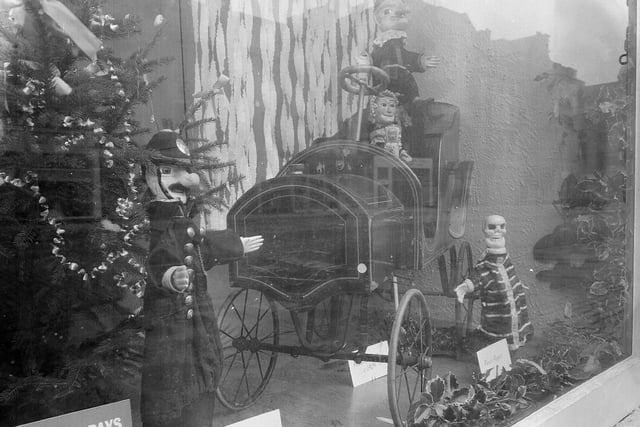 The Music Hall, on George Street, had an interesting window display with Punch and Judy figures and a mechanical train. This photo was taken just before Christmas in 1962.