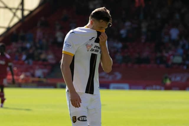 Livingston's Jack Fitzwater leaves the pitch after he receiving a red card at Pittodrie. Picture: Alan Harvey / SNS