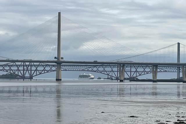 Royal Caribbean cruise ship Jewel of the Seas is spotted beneath the Forth Bridges in Queensferry