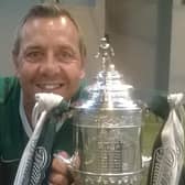 David Gardiner poses with the Scottish Cup trophy following Hibs' historic win in 2016
