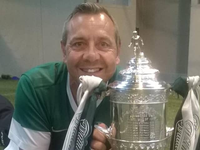 David Gardiner poses with the Scottish Cup trophy following Hibs' historic win in 2016