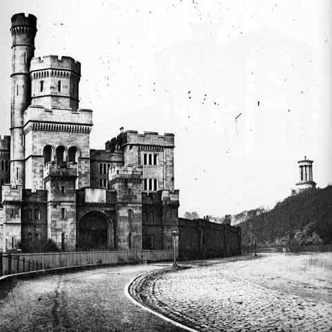 Calton Jail at Regent Road and showing the Dugald Stewart Monument on Calton Hill.