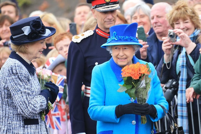 Her Majesty The Queen with flowers she received at Newtongrange Train Station.