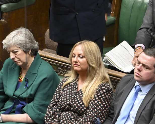 Dr Lisa Cameron sits beside former prime minister Theresa May adn Douglas Ross after joining the Conservative party ranks