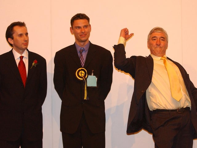 Lib Dem Mike Pringle shows his delight at winning Edinburgh South from Labour by a narrow majority of 158.
Looking on at the declaration of results at Meadowbank are the previous MSP, Labour's Angus MacKay, and the SNP candidate Alex Orr.
Mr Pringle, who had served as a Morningside councillor, was re-elected in 2007 but lost the seat in 2011.