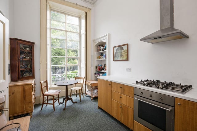 The spacious kitchen comes with plenty of storage space and a window looking out at leafy Stockbridge.