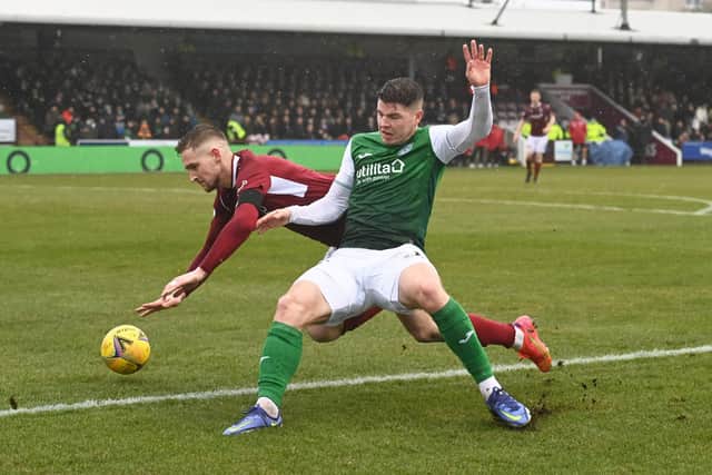 Nisbet in the thick of it against Arbroath defender Thomas O'Brien