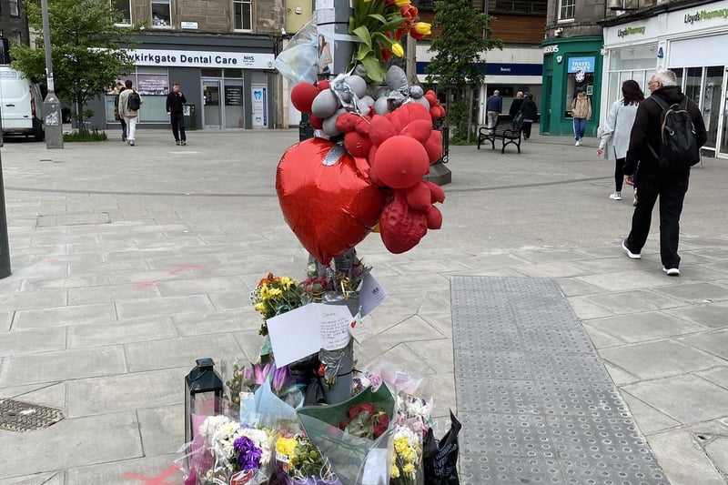 Friend and family have left flowers and messages in tribute to Danielle Davidson, 33, who lost her life following a disturbance on Constitution Street in Leith.